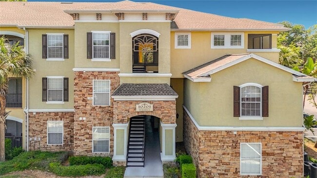 Building Photo - 10201 Courtney Palms Blvd Unit 203