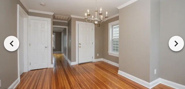 Dining room with hallway into living room - 126 N College St Unit 2