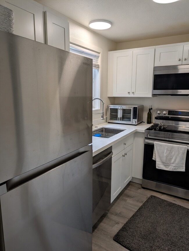 Galley Style Kitchen With Lots of Storage - 4159 38th Ave S Unidad 1