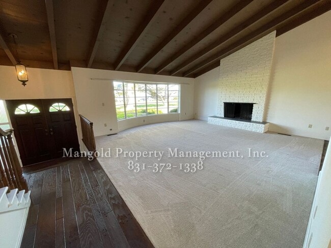 Photo - Beautiful 4-bed 2-bath Home with Cozy Fireplace, Front and Back Yards and Large Windows!