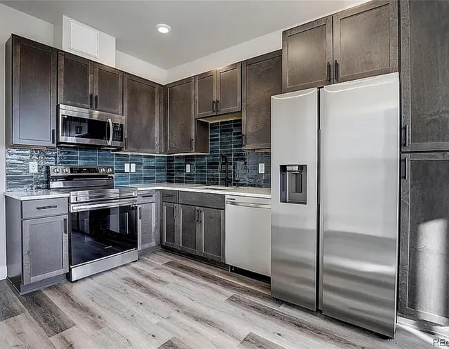 Building Photo - 1208 Quitman St Unit 404