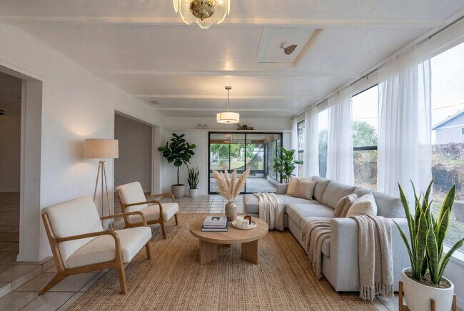 Photo - Recently painted 4BR/3BA home with tile floors throughout, fenced yard, detached garage, and prim...