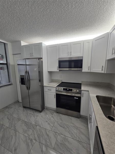Building Photo - 1228 S Military Trail Unit 2114 Rental