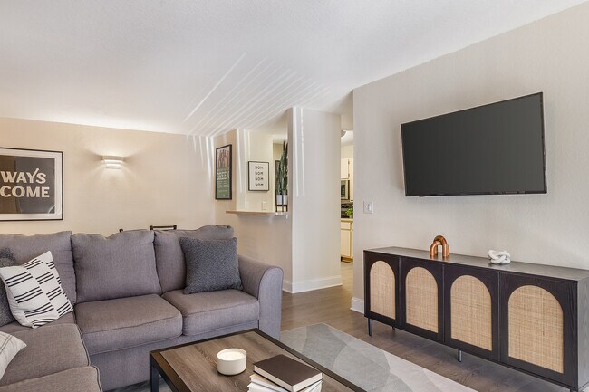 Experience comfort in this elegantly designed living room, perfect for relaxation and entertainment.