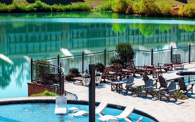 Italian marble tile pool deck overlooking the lake