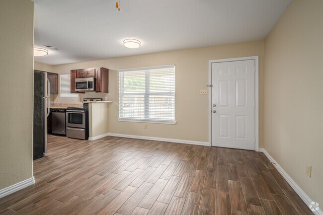 1BR, 1BA - 780SF - Living Room - Twin Pines