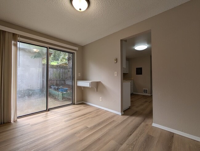 Photo - Bright 3 bedroom/ 1 bathroom Duplex with a fireplace and covered parking!