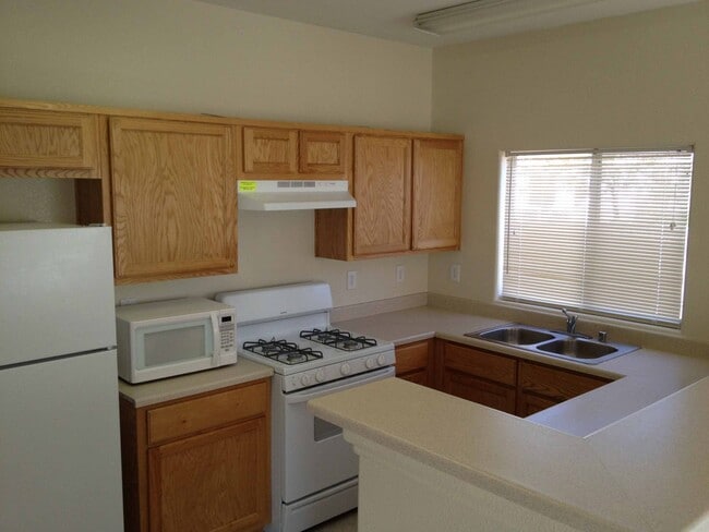 Photo - Two Story townhouse with one car garage.