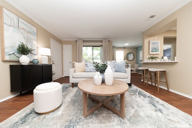 Spacious living room with hardwood-style flooring - Vetra at Hamilton Place