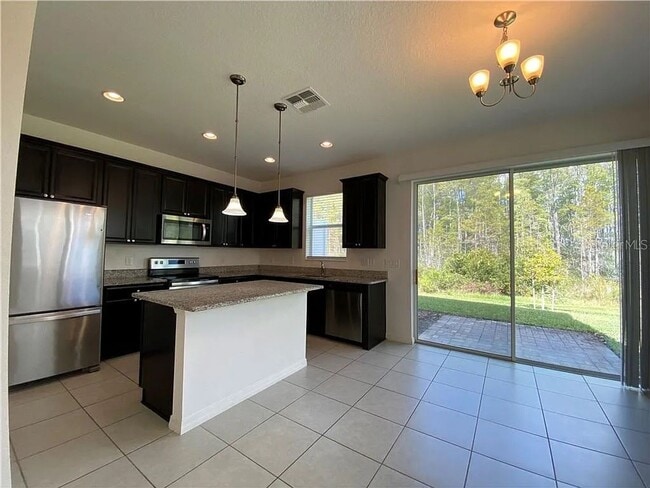 Photo - Beautiful End Unit Townhome Near Lake Nona w/ 2-Car Garage & Conservation Views!