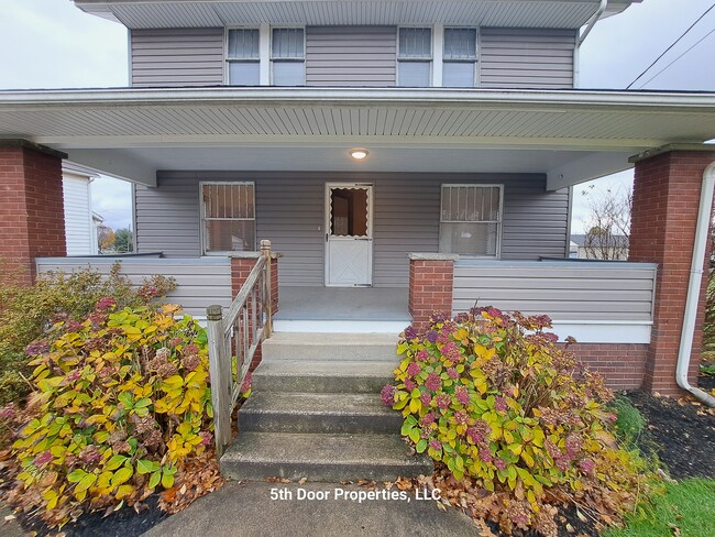 Huge front porch - 6312 Louisville St NE Townhome