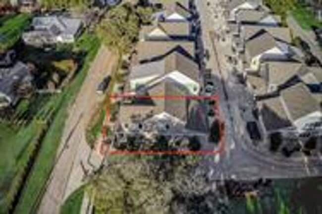 Photo - This charming two-story home, built in 2018, offers a spacious open floor plan perfect for casual...