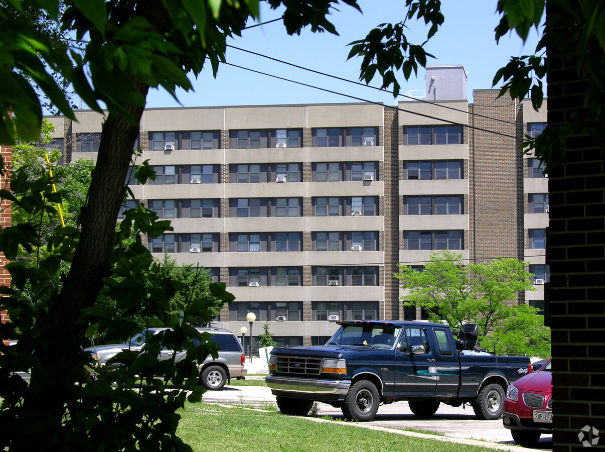 Through the trees to the west - Mason Manor Housing Authority Apartments