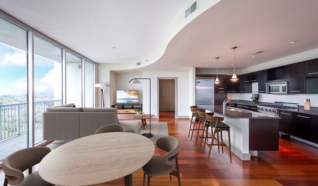 Spacious living room features floor-to-ceiling windows with amazing views of Buckhead
