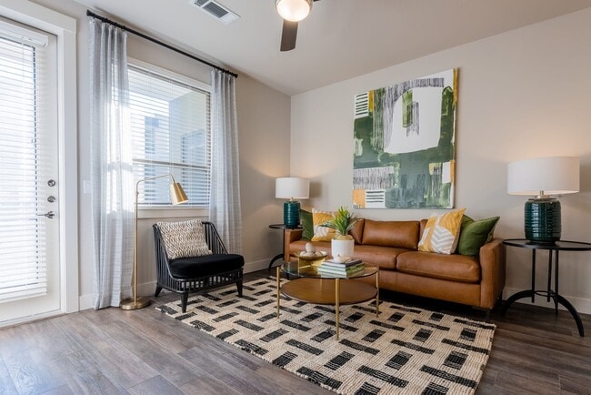 Living room with hard surface flooring - Avalon Lowry Apartments