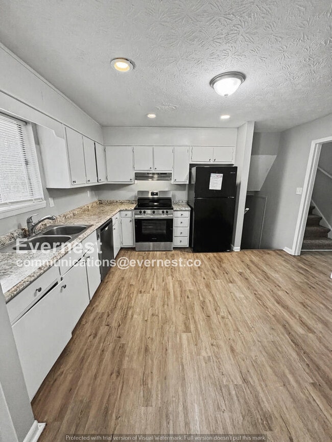 Photo - 4 Bed, 2 Bath Home with Garage / Pet-Friendly / Available Now!