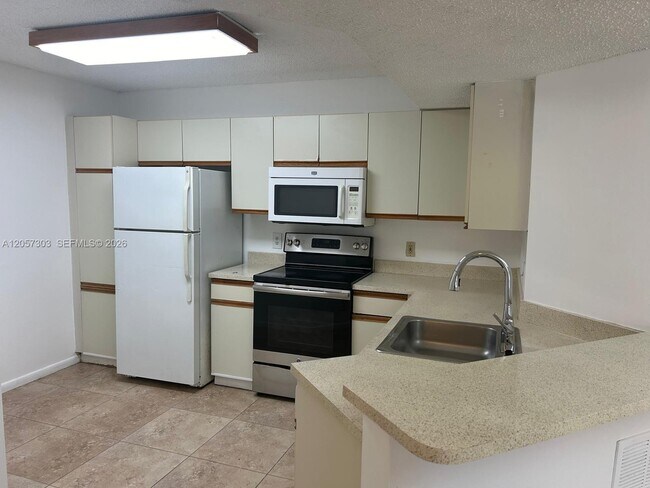 8851 Wiles Rd Unit 208