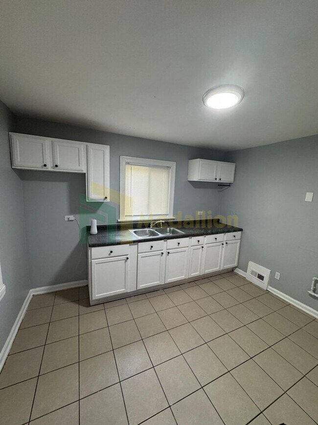 Photo - Stylish 4BR/2BA Home with Modern Updates &...
