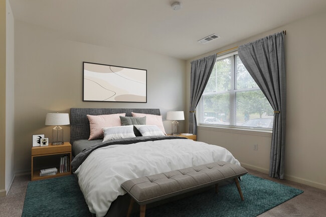 Bedroom with hard surface flooring (in select homes)