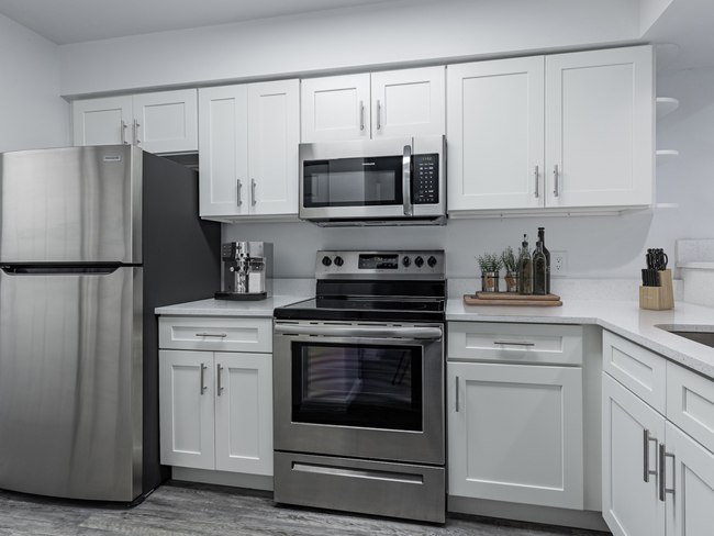 Kitchen with White Finishes - Cobblestone Apartments