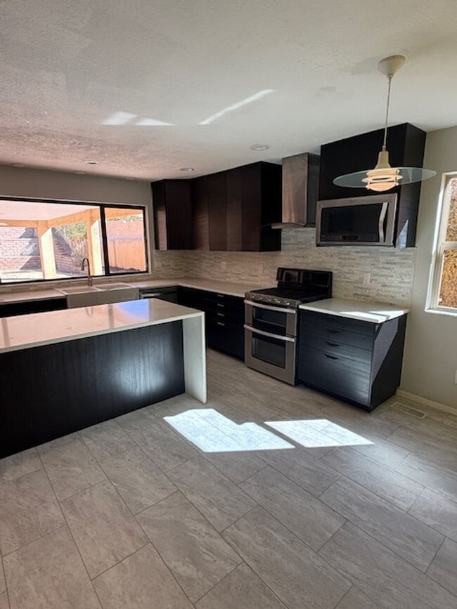 Photo - Beautiful NE Heights Neighborhood Executive style home with a Large back yard that has a full siz...