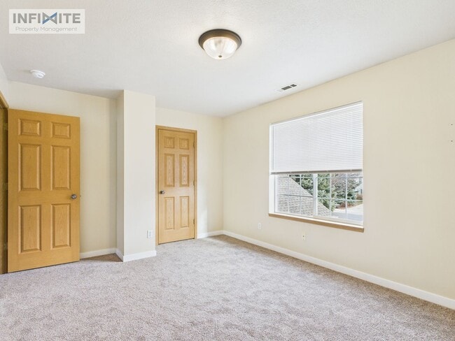 Photo - Bright & Spacious 2 Bedroom, 2 Bath Condo with Single Detached Garage – Move-In Ready!