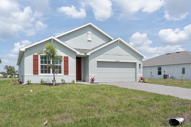 "Spacious 4-Bedroom Gem with 2 Full Baths in Charming Punta Gorda Oasis!"