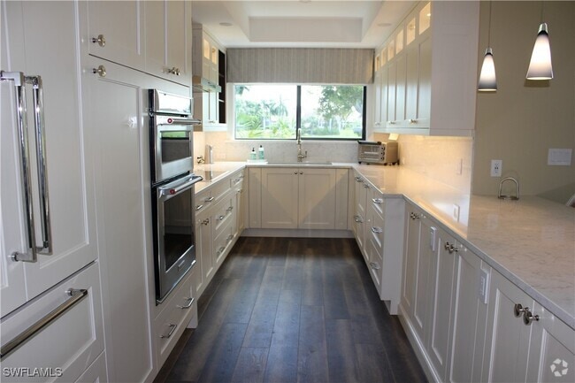 Building Photo - 6760 Pelican Bay Blvd Unit 313 Rental
