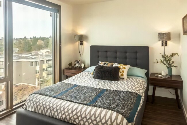 Glass wraps the corner, so the room takes light from two directions.
