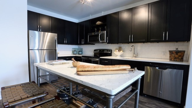 Modern kitchens with stainless steel appliances and moveable islands