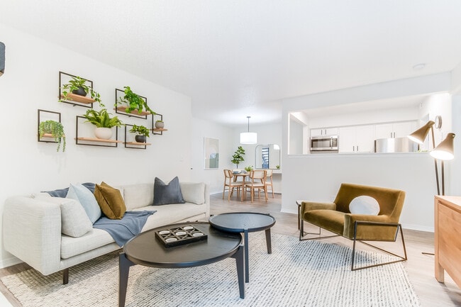 Open-Concept Living and Dining Area Connected to Modern Kitchen - Diamond Interior - Dylan Apartments