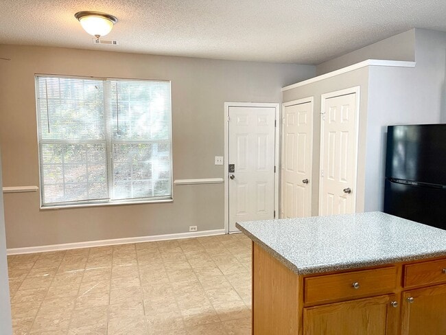 Photo - Welcome to this charming brick townhome in...