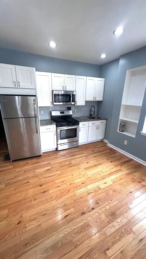 Building Photo - 5578 Ludlow St Unit 1