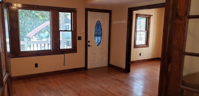 Livingroom to Front door, bedroom on right - 87 Woodlawn St Unit 87 Woodlawn St