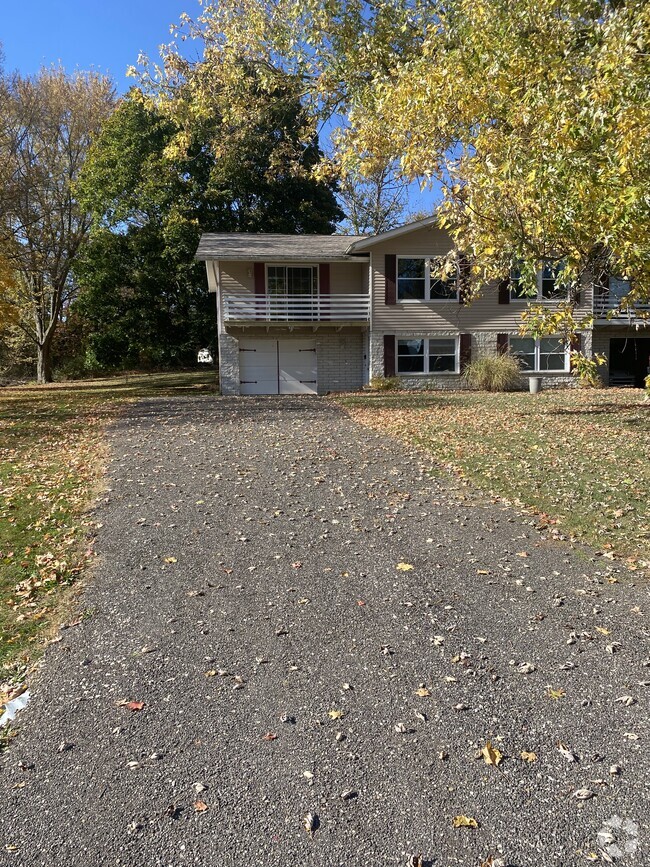 Front of house with garage and balcony - 4472 King Arthur Dr Rental