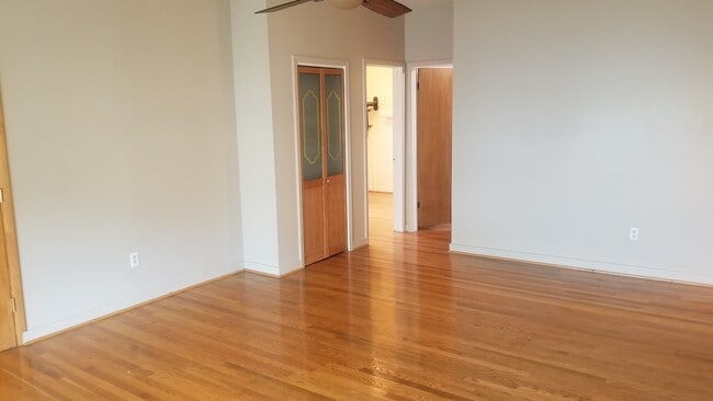 View looking from front room to two bedroom doors