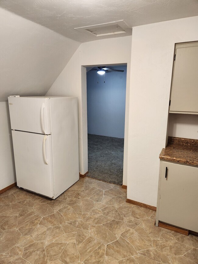 Kitchen looking into living room - 543 N Meade St Unit 1 Upper