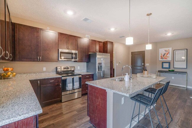 Our beautiful, modern kitchens have stainless steel appliances and plenty of counter space for all your cooking needs. - The Flats at Shadow Creek Apartments