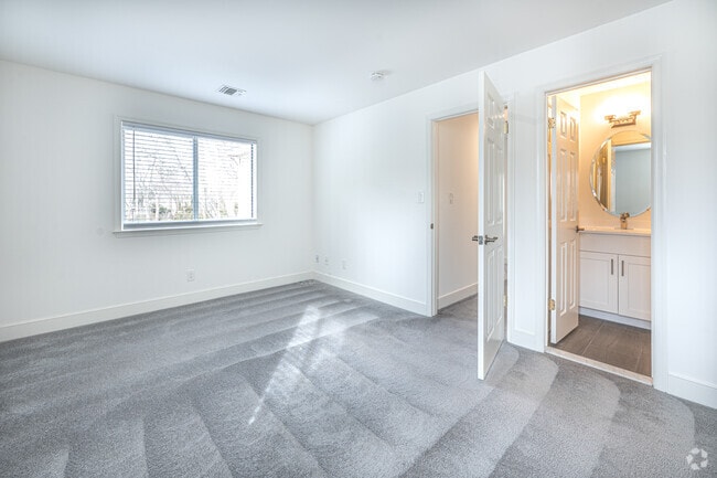 1BR, 1BA - 806SF - Primary Bedroom - Greenview at West Sayville