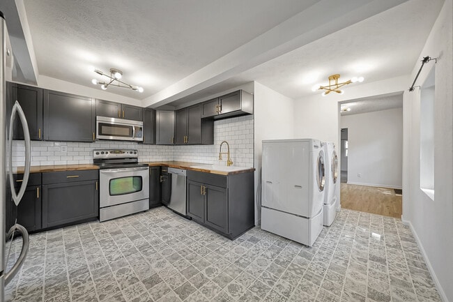 Building Photo - 4209 Touzalin Ave Unit 1