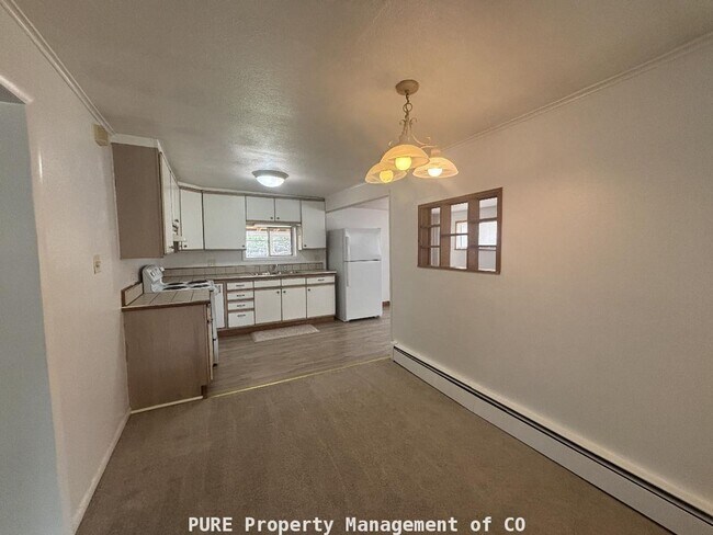 Photo - Cozy single family home with 1-car detached garage!