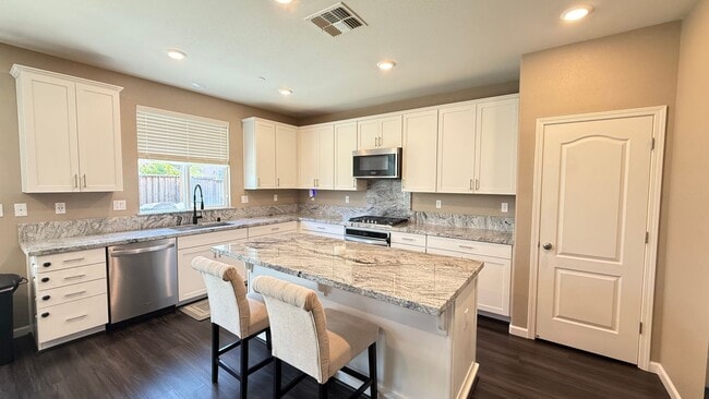 Photo - Spacious 5-Bedroom Home | Private Yard + Attached Garage