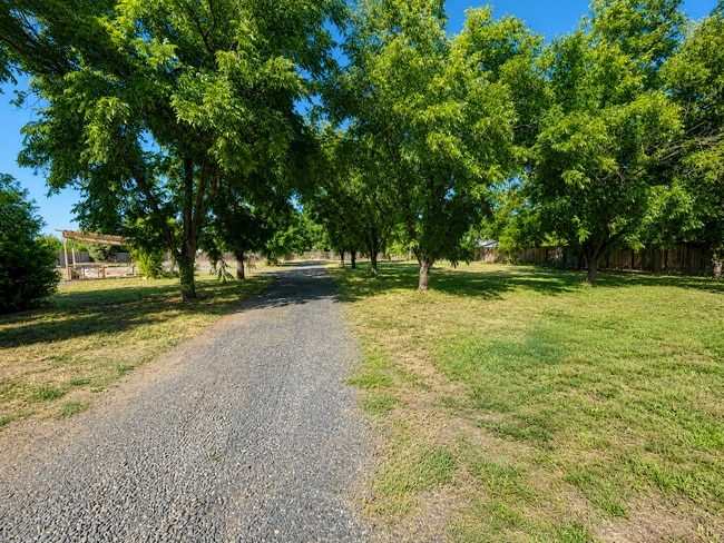 Photo - Private 3BR Home on Approx. 1 Acre | Huge Fenced Yard, Sunroom & 2-Car Garage