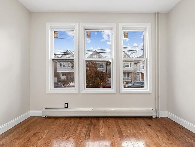 Photo - 3-Bedroom Gem with Modern Comfort in Bayonne – 1300 Sq. Ft. of Urban Living!"