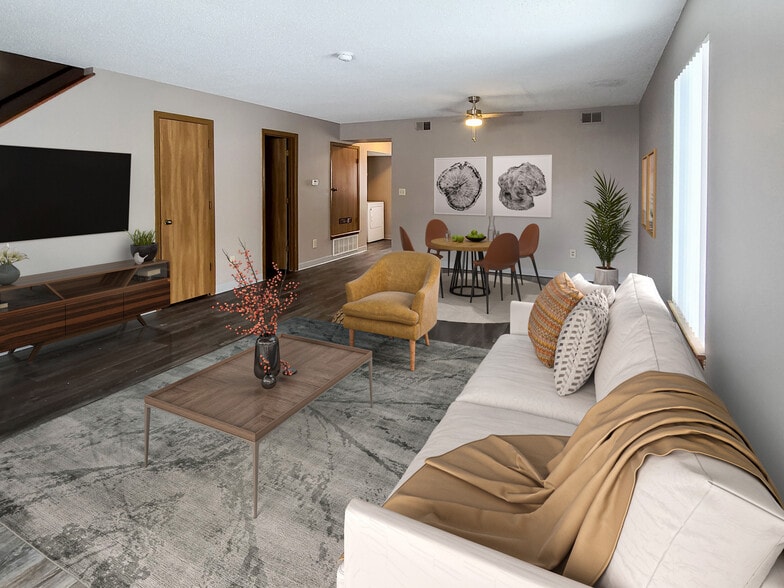 Renovated Three-Bedroom Apartment Living and Dining Area at Prairie West in Ames, IA