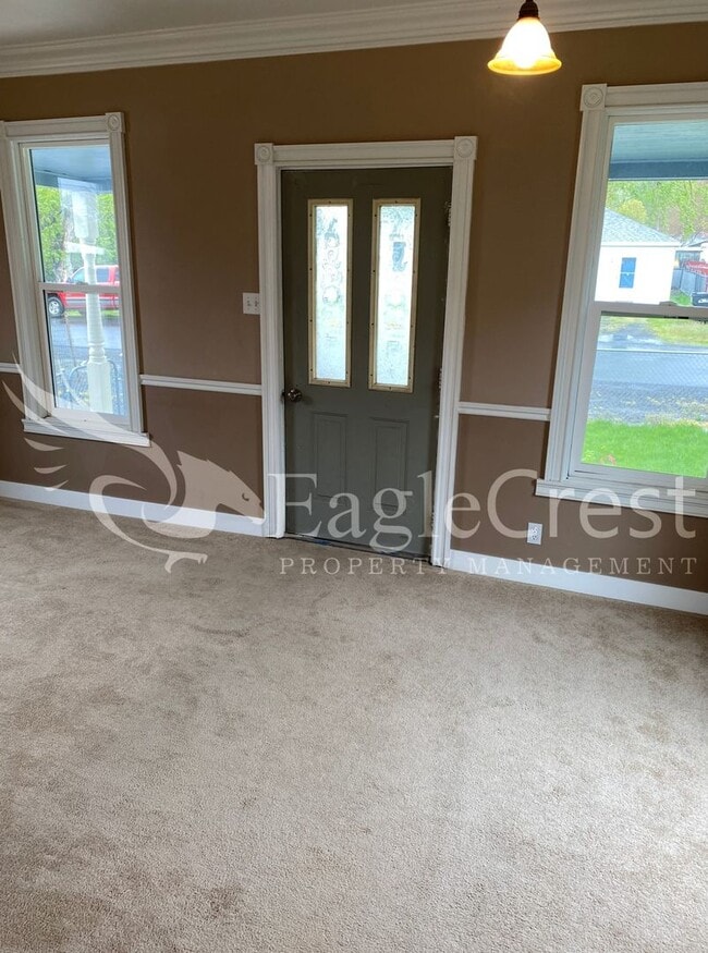 Charming 2 Bedroom Home With 1 Car Garage and A Covered Porch