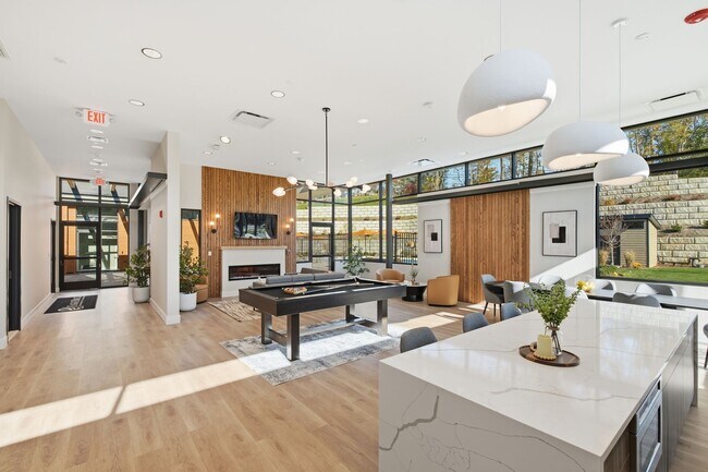Elevate your lifestyle at Eagle Rock Apartments at Woodbury with this stylish and airy interior. Enjoy modern amenities, abundant natural light, and a welcoming atmosphere. Schedule your visit today and see the difference!