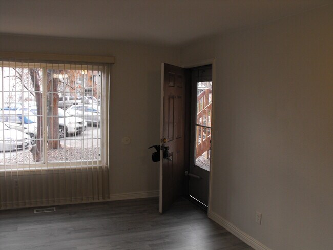 Living room looking towards entry door - 165 S Sable Blvd Unit R18