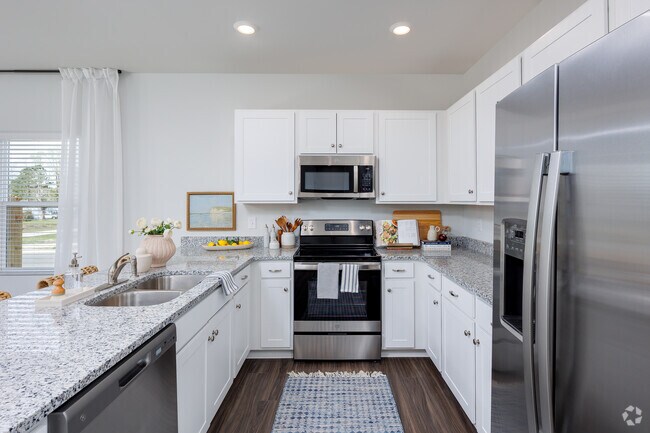 Kitchen from hallway. - Mill Branch At Spring Hill