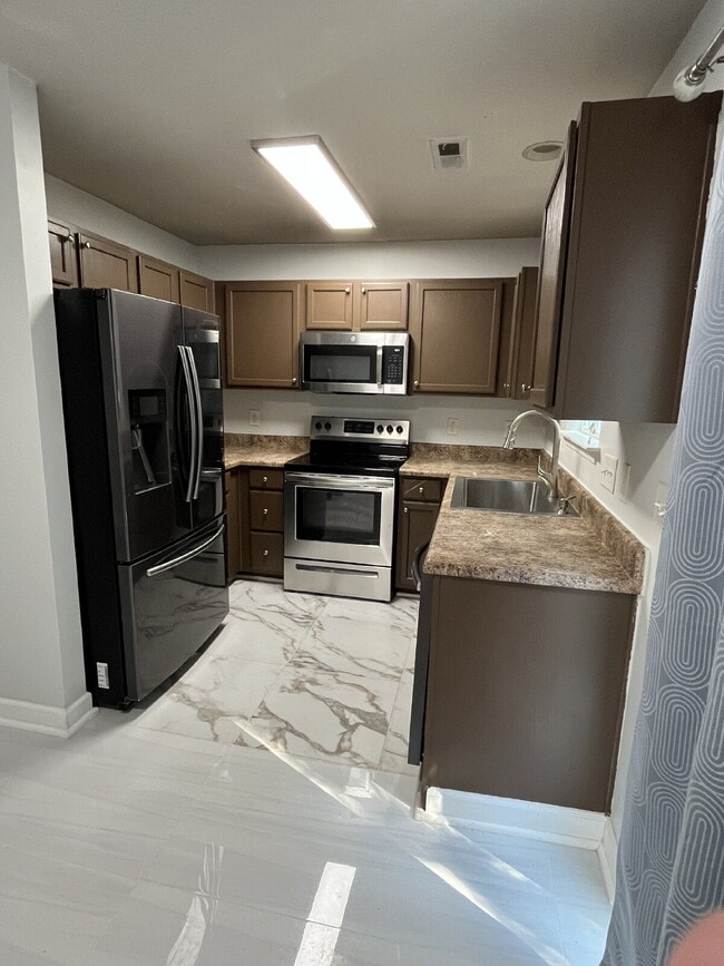 Photo - "Chic & Cozy: Modern 2-Bed Townhouse with Marble Accents in Greensboro!"